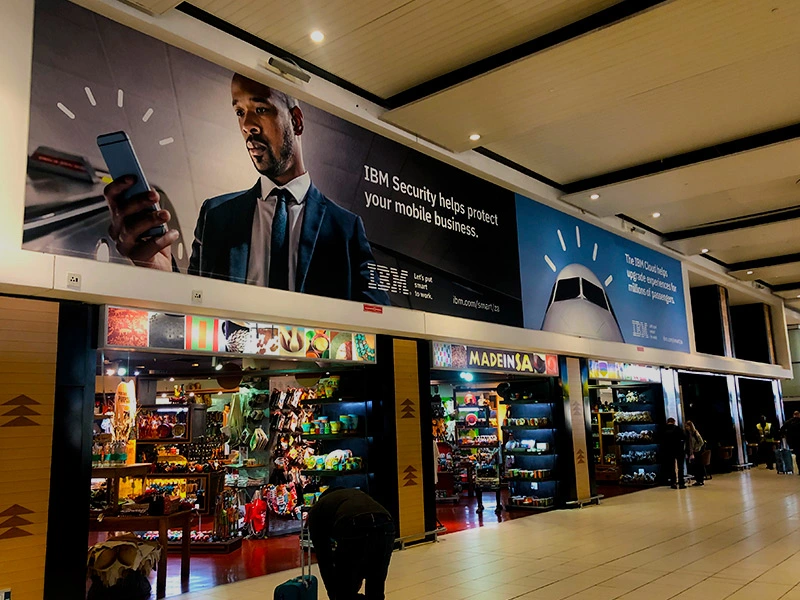 Large format advertisement inside an airport terminal