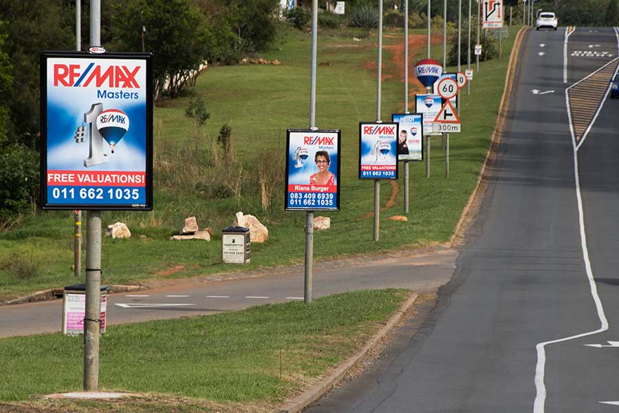 Street pole advertisement for a real estate agency